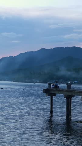 Fisherman on Pier at Dusk