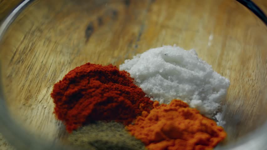 Different spices blended together in bowl, close up