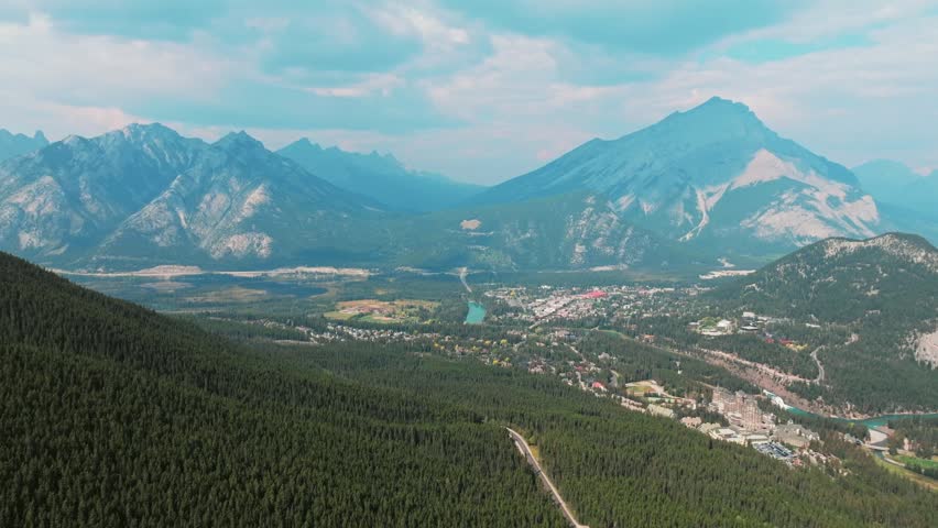 Aerial Revealing shot, Town of Banff, Morning shot. Banff National Park, Alberta, Canada.