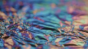 A mesmerizing view of colorful liquid flowing over a shiny foil surface creating vibrant reflections. - Powered by Shutterstock - Get 15% off with code: PIKWIZARD15