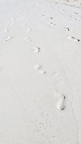Footprints Beach With White Sand.