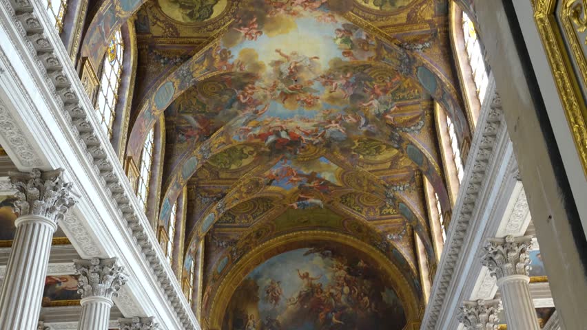 Ceiling frescoes inside Versailles Palace chapel with painted scenes, arches and columns. Upward view showing detailed baroque interior and decorative artwork