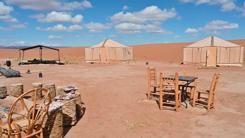 First person view walking through a luxury Berber campsite in Erg Chigaga, Morocco