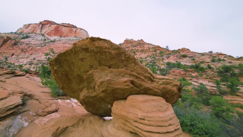 Footage of the iconic balanced rock formation near the Pine Creek Canyon overlook on the easy-to-moderate Canyon Overlook Trail in Zion National Park, Utah.