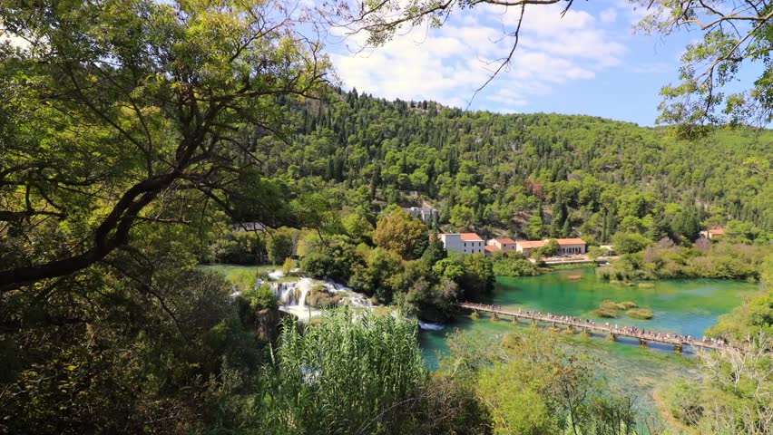 Breathtaking aerial view of Plitvice Lakes National Park in Croatia, showcasing the lush greenery, turquoise waters, and stunning natural scenery. Ideal for travel, nature, and landscape projects.