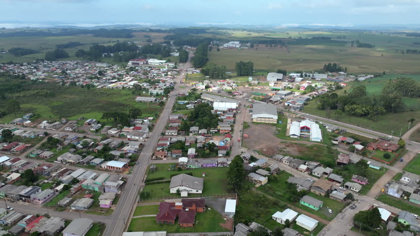 Aerial approach to Bom Jesus showing residential blocks, main roads and a roundabout in southern Brazil