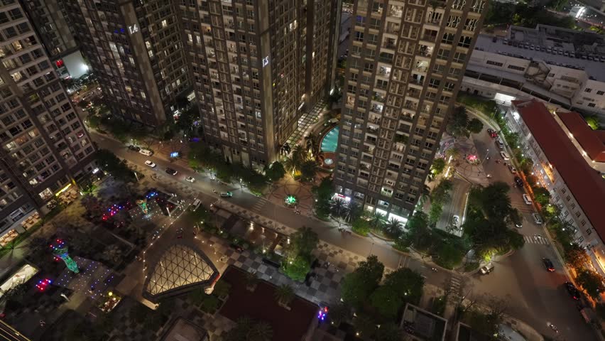 Night view of Saigon cityscape with buildings and streets below