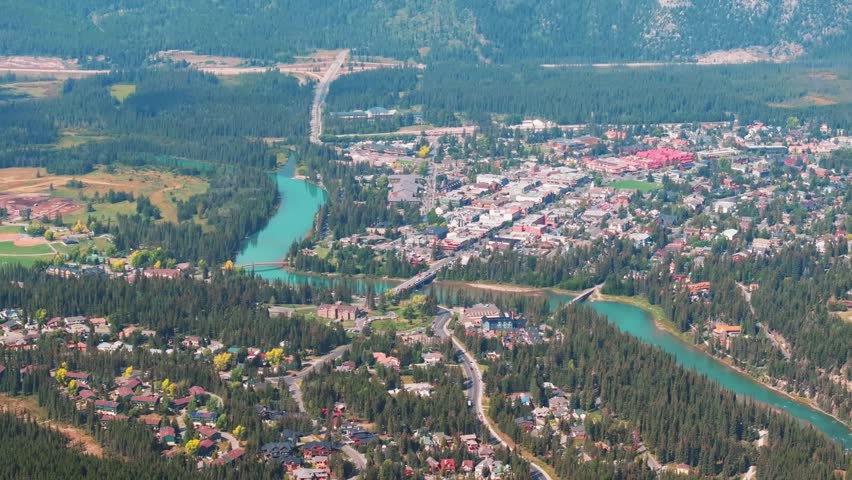 Aerial Revealing shot, Town of Banff, Morning shot. Banff National Park, Alberta, Canada.
