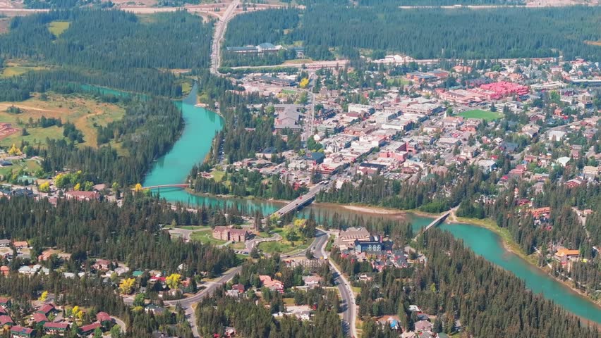 Aerial Revealing shot, Town of Banff, Morning shot. Banff National Park, Alberta, Canada.