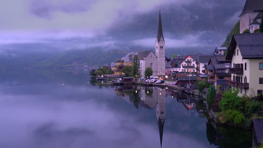 Hallstatt Village Morning Salzkammergut Region Austria 4K UHD. Morning mist at beautiful Hallstatt village on Hallstatter Lake in the Austrian Alps in the region of Salzkammergut, Austria. 4K, UHD.
