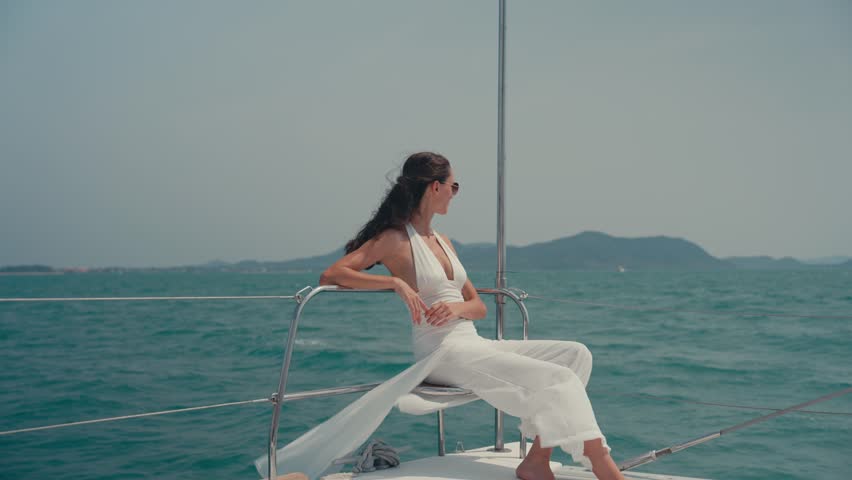 Summer yatching relax happy wellness couple man woman adult young enjoy calm ocean breeze sailboat deck vacation travel lifestyle leisure freedom serene mood health retreat blue water clear sky
