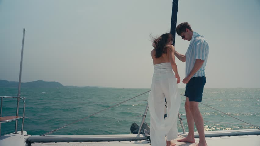 Summer yatching relax happy wellness couple hug sailboat deck bright sun calm sea horizon leisure travel romance vacation freedom ocean wind romantic lifestyle sea leisure romance travel joy carefree