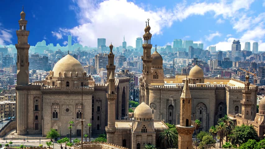 A stunning view of the Ottoman-style Mosque of Muhammad Ali (Alabaster Mosque) in Cairo, Egypt. Featuring its iconic silver central dome and twin pencil-shaped minarets reaching into the skyline. This 19th-century architectural masterpiece is famous for its extensive use of alabaster on the exterior walls and its grand interior courtyard.