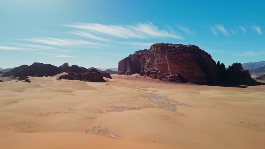 Drone over sandy desert with big rocky mountains in wadi rum in jordan