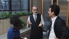 Experienced senior executive leading briefing diverse professional team modern office representing mentorship corporate leadership effect communication inclusive business collaboration - Powered by Shutterstock - Get 15% off with code: PIKWIZARD15