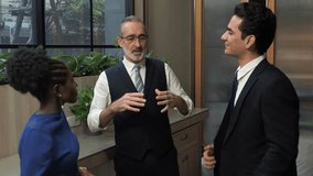 Experienced senior executive leading briefing diverse professional team modern office representing mentorship corporate leadership effect communication inclusive business collaboration - Powered by Shutterstock - Get 15% off with code: PIKWIZARD15