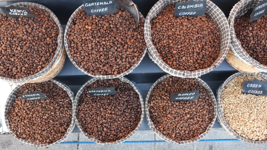 Footage of multiple coffee types in baskets, including kenya, guatemala, colombia, ethiopia, costarica, and romeo coffee.