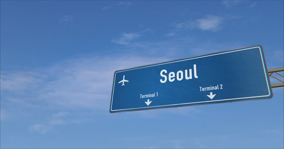 Airplane landing in Seoul. Plane travel to South Korea arrive with airport signboard.