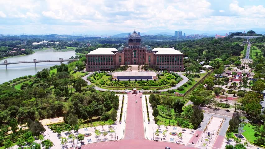 Vibrant Kuala Lumpur cityscape under bright sunlight showcasing modern skyscrapers and dynamic Asian city life. Bustling urban environment highlighting economic growth, cultural diversity, and contemporary architecture in Southeast Asia metropolis.