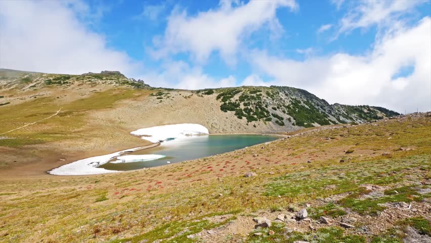 footage of the scenic Mount Fremont Lookout Trail in Mount Rainier National Park, Washington State. This popular moderate hike, accessible from the Sunrise Visitor Center, winds through alpine meadows
