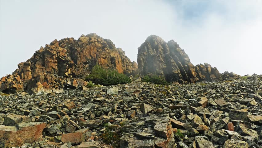 A sweeping view of the rugged, rocky terrain and jagged peaks along the Mount Fremont Lookout Trail. The footage captures the high-alpine environment of the Sunrise area in Mount Rainier National Park
