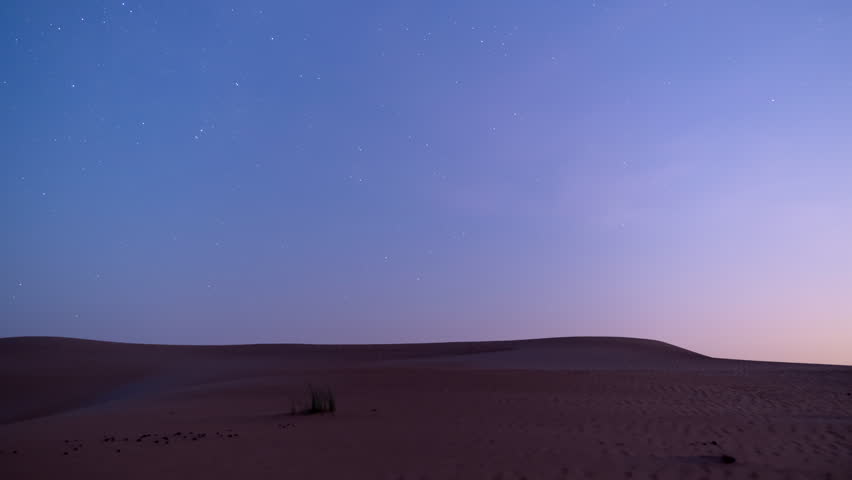 Stunning 4k timelapse of stars Milky Way galaxy motion over the desert sand dune after moonset.