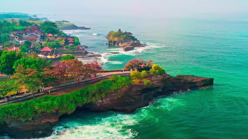 Beautiful beach with old rock formations in Tanah Lot, Bali, Indonesia