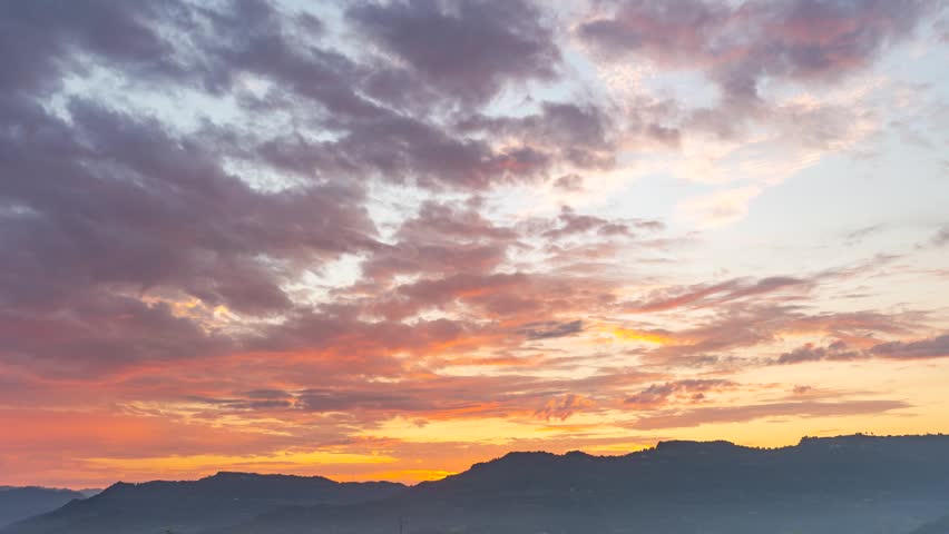Mountain Sunrise With Fiery Clouds Illuminating the Sky at Dawn