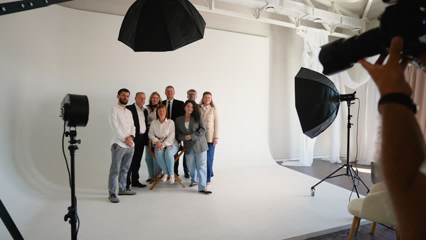 Professional photographer taking picture of a business team