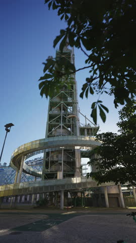 Low angle view of the industrial tower and curved walkways at Factory Lisbon innovation hub