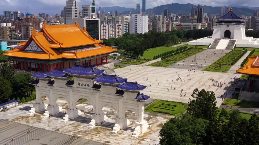 Aerial view of Chiang Kai-shek Memorial Park in Taipei, Taiwan on a sunny day, showcasing historic architecture, landscaped gardens and iconic landmark.