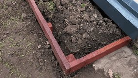 Raised Garden Bed Installation Next to Greenhouse in Backyard Setting - Powered by Shutterstock - Get 15% off with code: PIKWIZARD15