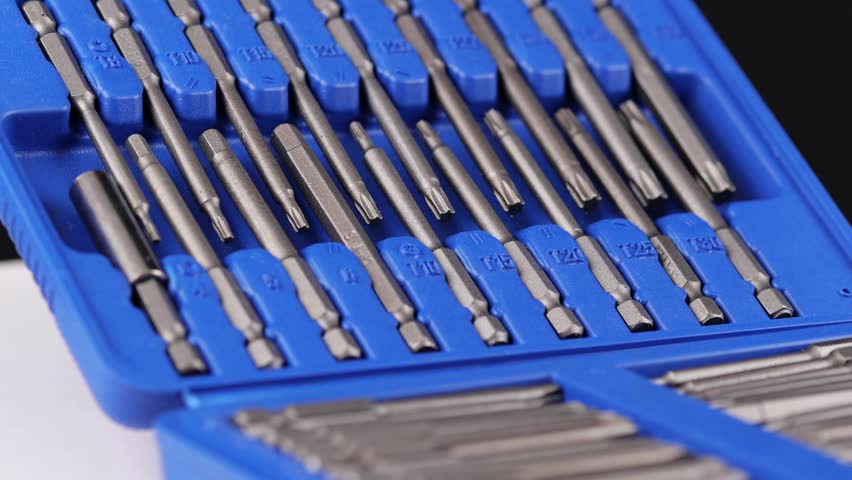 A set of tools with bits in a plastic case.
