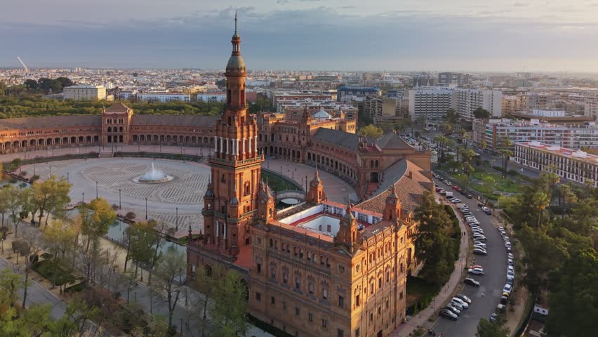 Aerial view of Plaza de Espana in Seville at sunrise, majestic architecture of the grand square and park. Golden hour over the Plaza de Espana and Maria Luisa Park, Seville