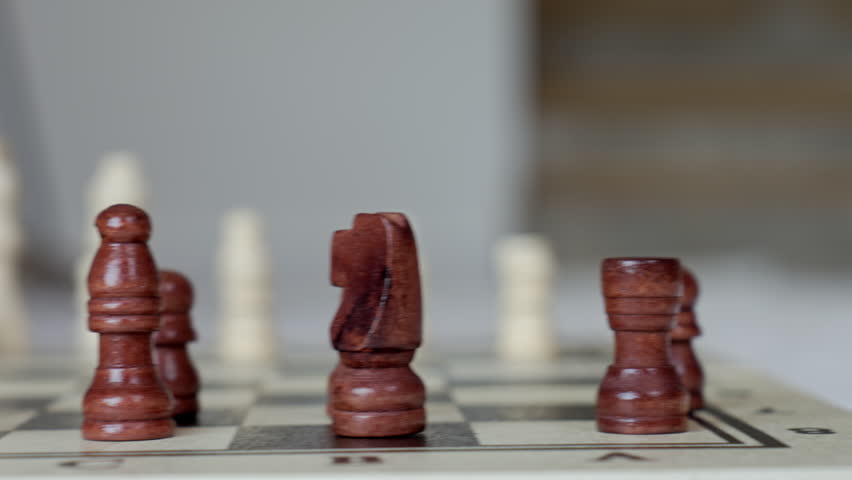 Close up of wooden chess pieces on chessboard during game. Concept of strategy, logic, planning and intellectual board game