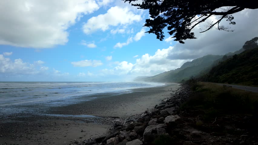 Wide Tropical Beach Under Cloudy Sky