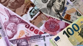 Paper money, banknotes of different countries in several denominations as a business background. Paper money and cash as a financial background for your design - Powered by Shutterstock - Get 15% off with code: PIKWIZARD15