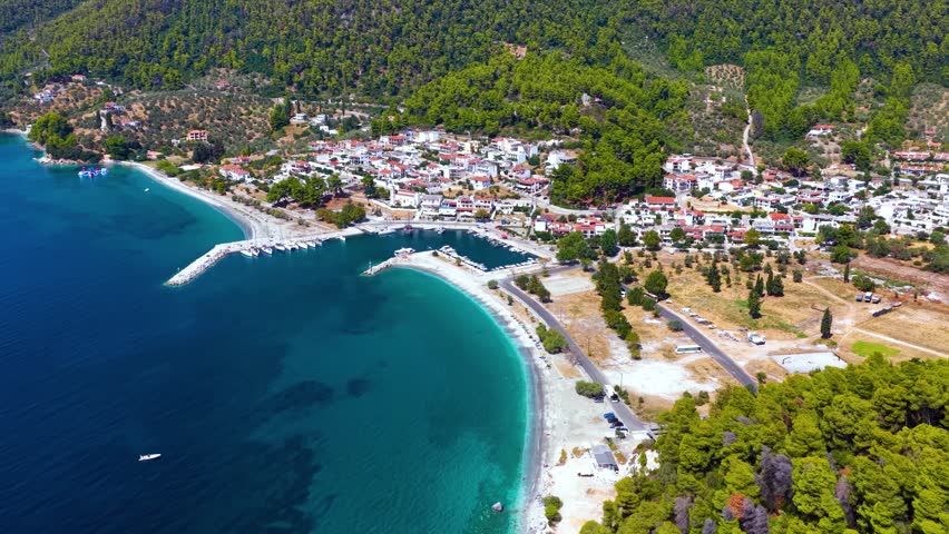 Establishing, aerial view of the beautiful coast of Skopelos island, Sporades, Greece, with the popular Hovolo beach and Neo Klima village