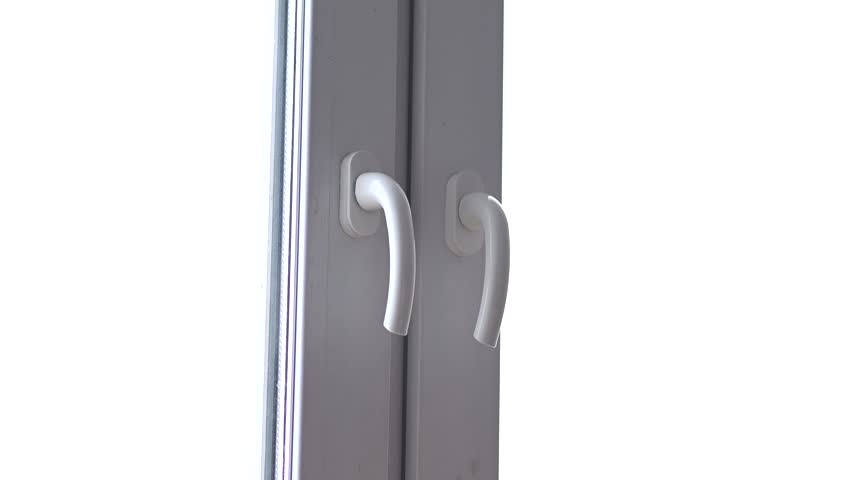 woman hand opening white plastic window by handle, in house or apartment or office, young caucasian girl in warm plaid shirt