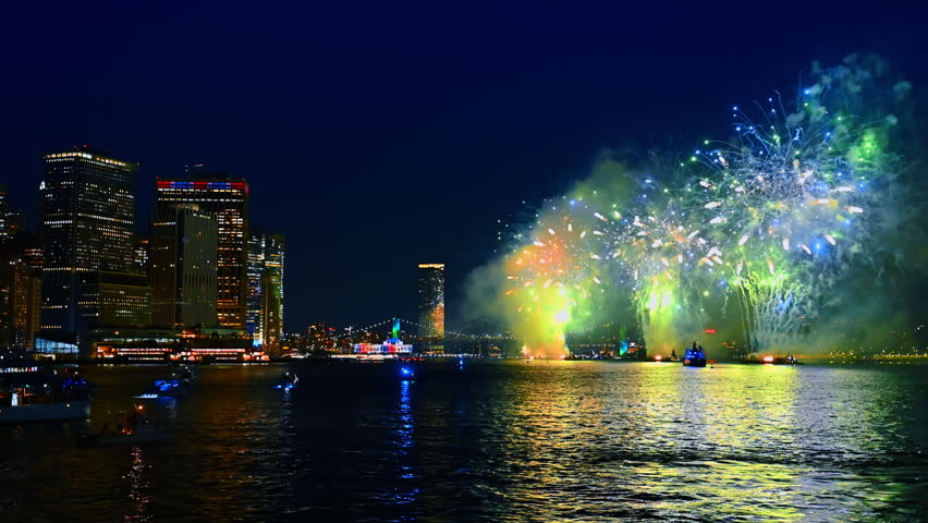 Fireworks splashing over the East River in New York. Celebration in New York at night.