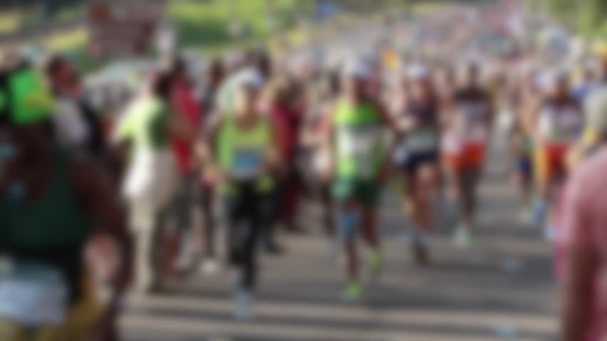 Slow motion of marathon runners defocused 