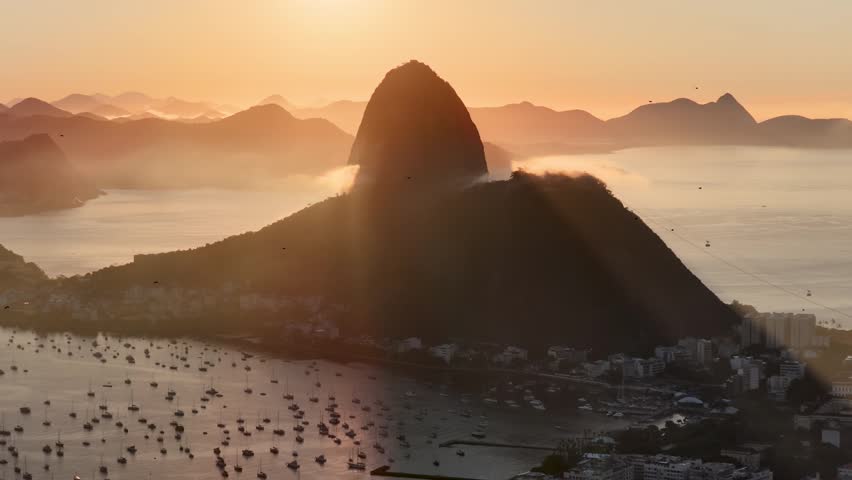 Sunset Sugarloaf Mountain In Rio De Janeiro Brazil. Turquoise Ocean Waves Gently Crashing On Tropical Beach. Sunrise Clouds Sky Beach Sea. Sunrise South America Beach Panoramic.