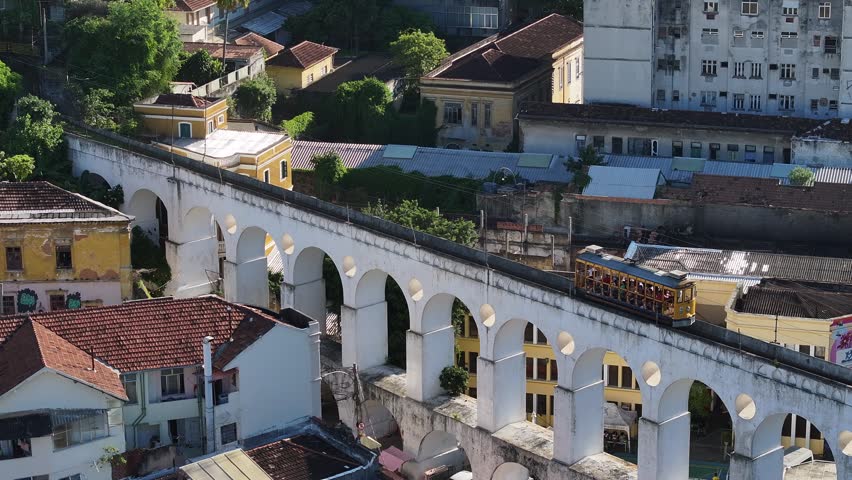 Arches Of Lapa In Rio De Janeiro Brazil. Aerial View Of Urban Railway Station With Buildings In Background. Town Clouds Sky Backgrounds Urban. Town Drone View Panoramic City. Rio de Janeiro Brazil.