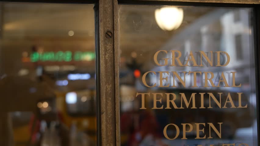 Grand Central Terminal on 42 street, New York City Manhattan Midtown. Details of railway building entrance in United States. American public railroad transport. Retro vintage station exterior. Doors.