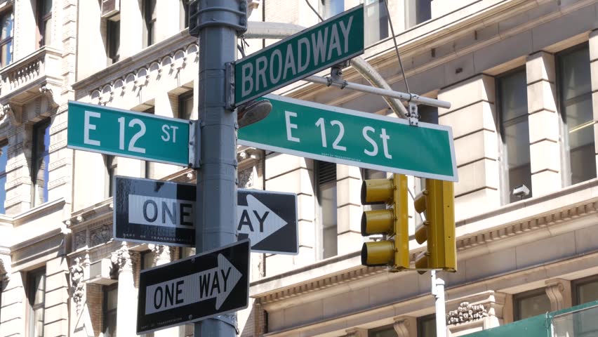 New York City Broadway street sign on Manhattan, United States. Urban road sign in american city. Traffic sign in Midtown of NYC, USA. Building architecture in residential district near Union Square.