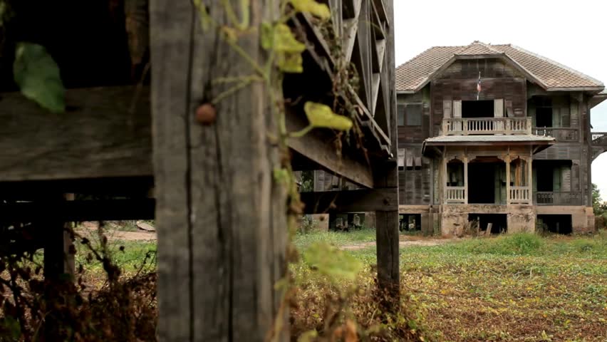 View of abandoned homes in poor neighborhood city. Derelict crumbling ruined mansion in suburbs. old ruined building. Apartment Building Demolition.