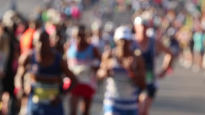 Blurred out runners running towards camera