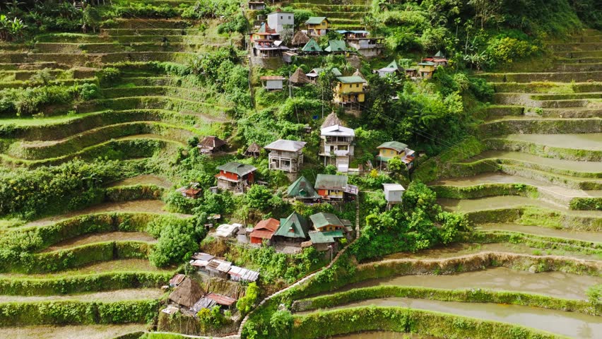 Drone slowly pulls back revealing Batad village among rice terraces Philippines