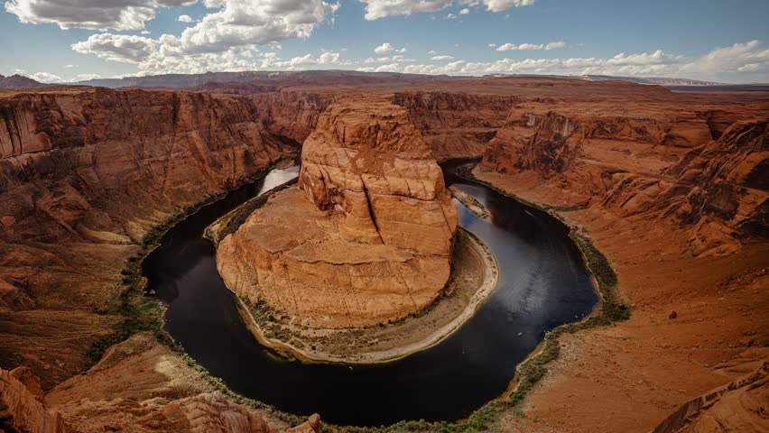 Horseshoe Bend at Grand Canyon with Colorado River and moving clouds, Arizona, time lapse camera zoom