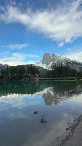 Emerald Lake mirroring Canadian Rockies mountain peak in Yoho National Park